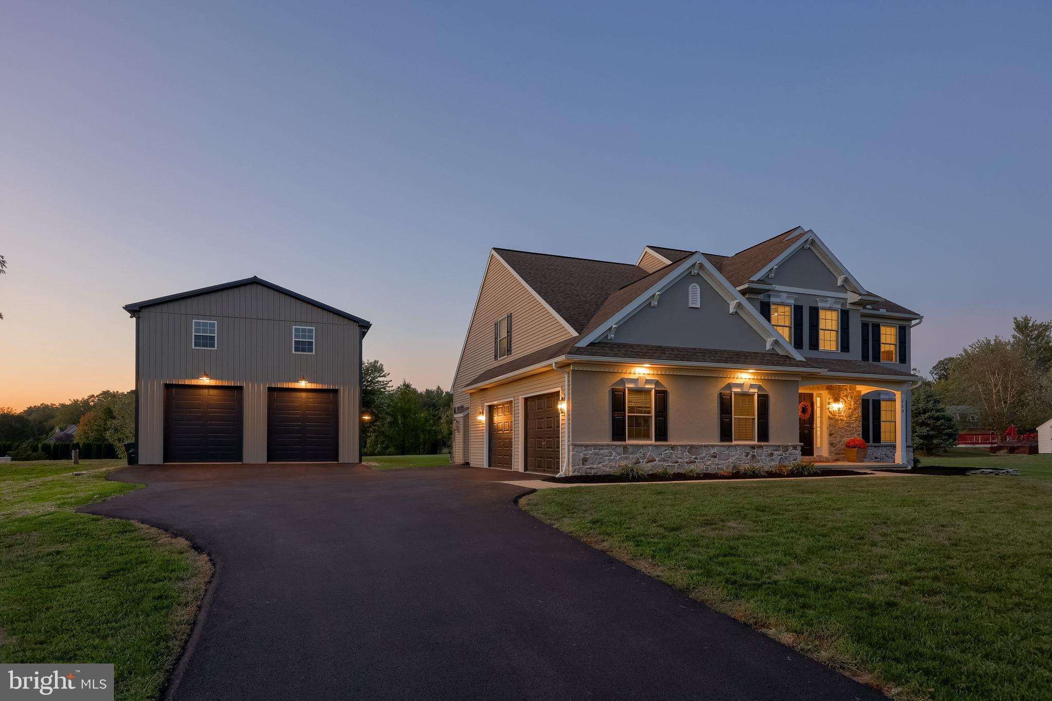 809 West Brubaker Valley Road Lititz, PA 17543 - Photo 1 of 58 a front view of a house with a garden and yard