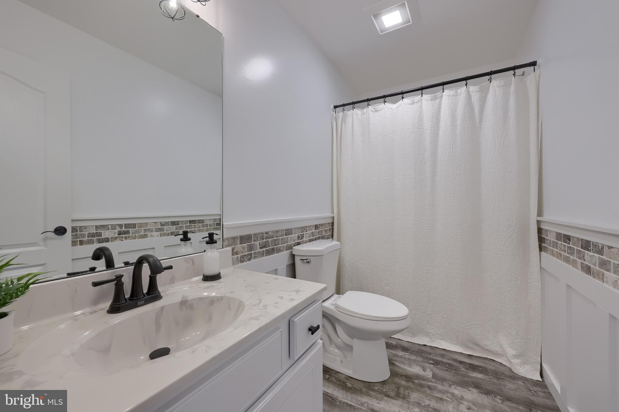 809 West Brubaker Valley Road Lititz, PA 17543 - Photo 24 of 58 a bathroom with a sink toilet and mirror