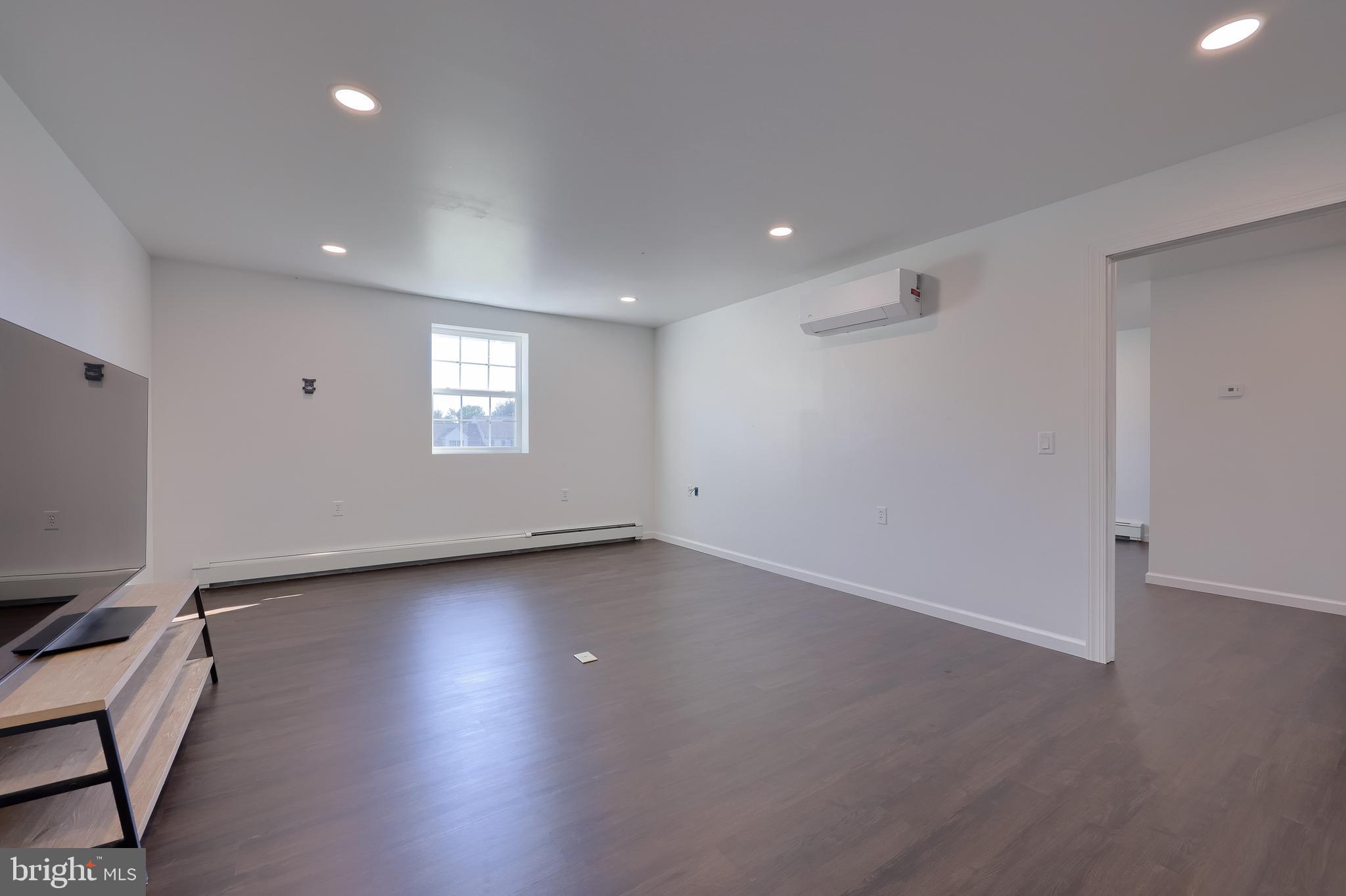 809 West Brubaker Valley Road Lititz, PA 17543 - Photo 38 of 58 a view of an empty room with a window and wooden floor