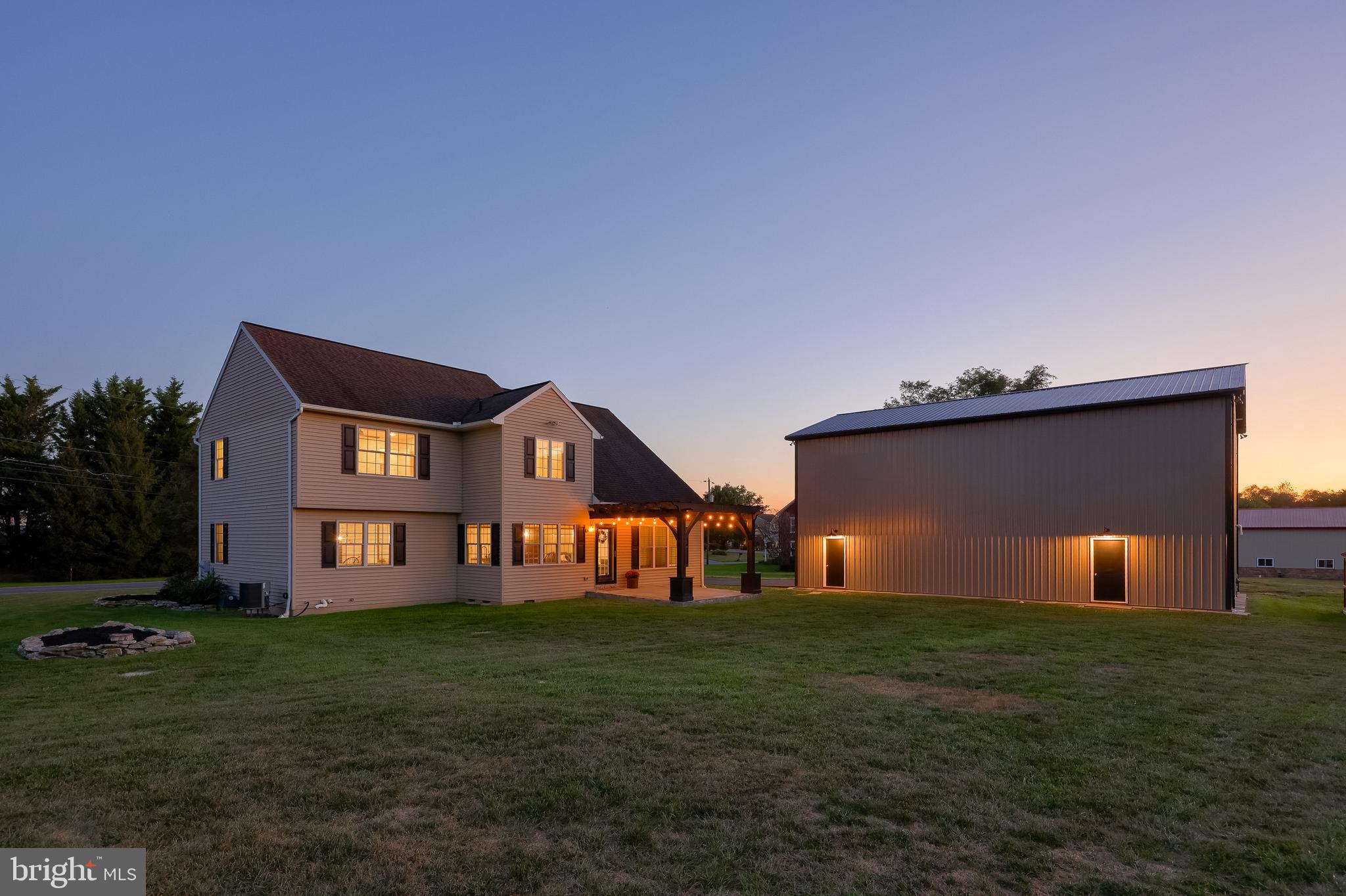 809 West Brubaker Valley Road Lititz, PA 17543 - Photo 50 of 58 a front view of a house with a yard and garage