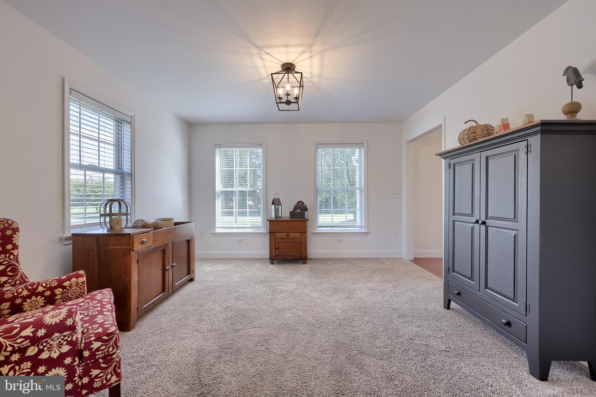 809 West Brubaker Valley Road Lititz, PA 17543 - Photo 5 of 58 a large bedroom with a bed and a chandelier