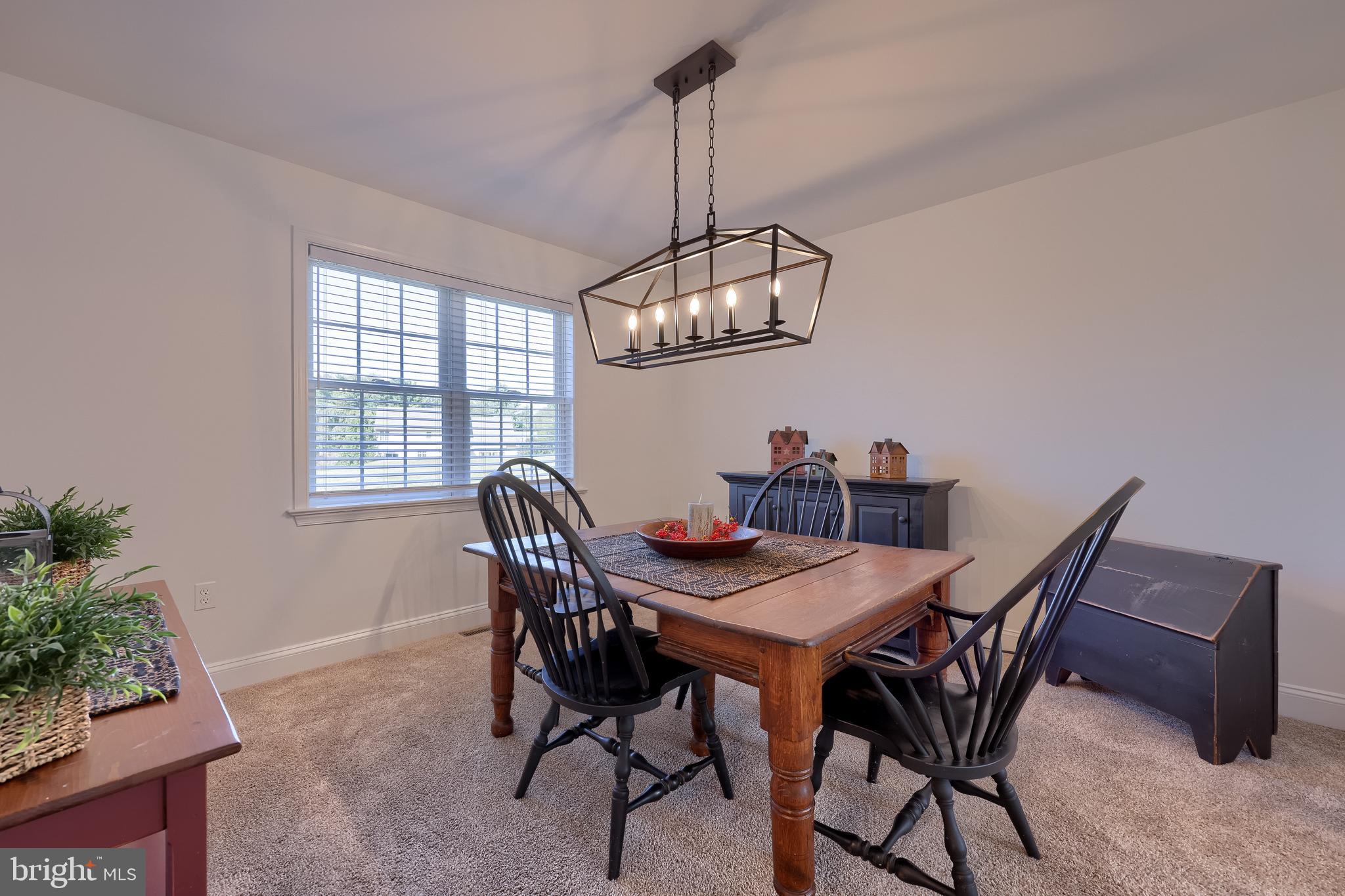 809 West Brubaker Valley Road Lititz, PA 17543 - Photo 8 of 58 a view of a dining room with furniture a chandelier and wooden floor
