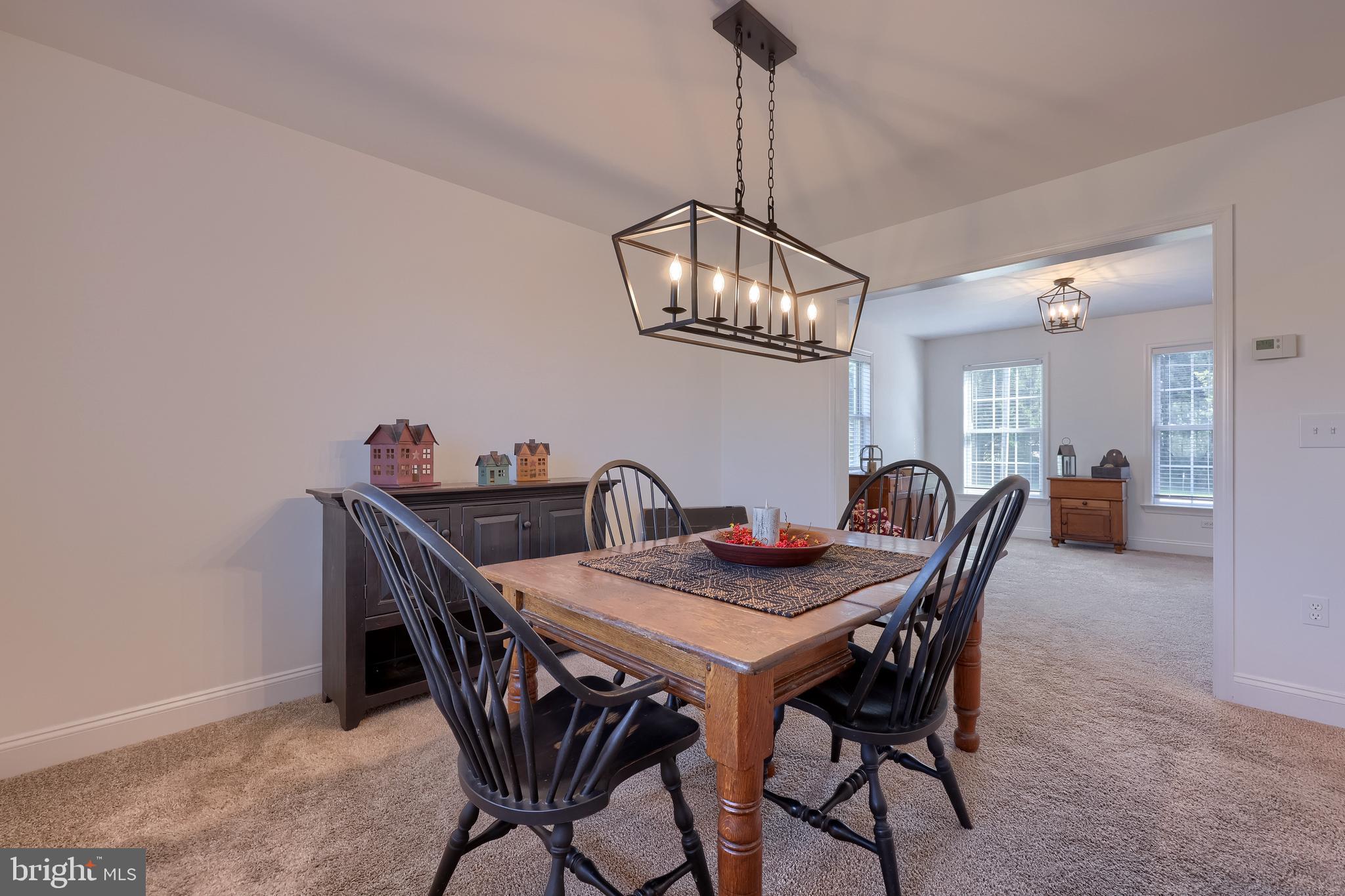 809 West Brubaker Valley Road Lititz, PA 17543 - Photo 9 of 58 a view of a dining room with furniture a chandelier and wooden floor