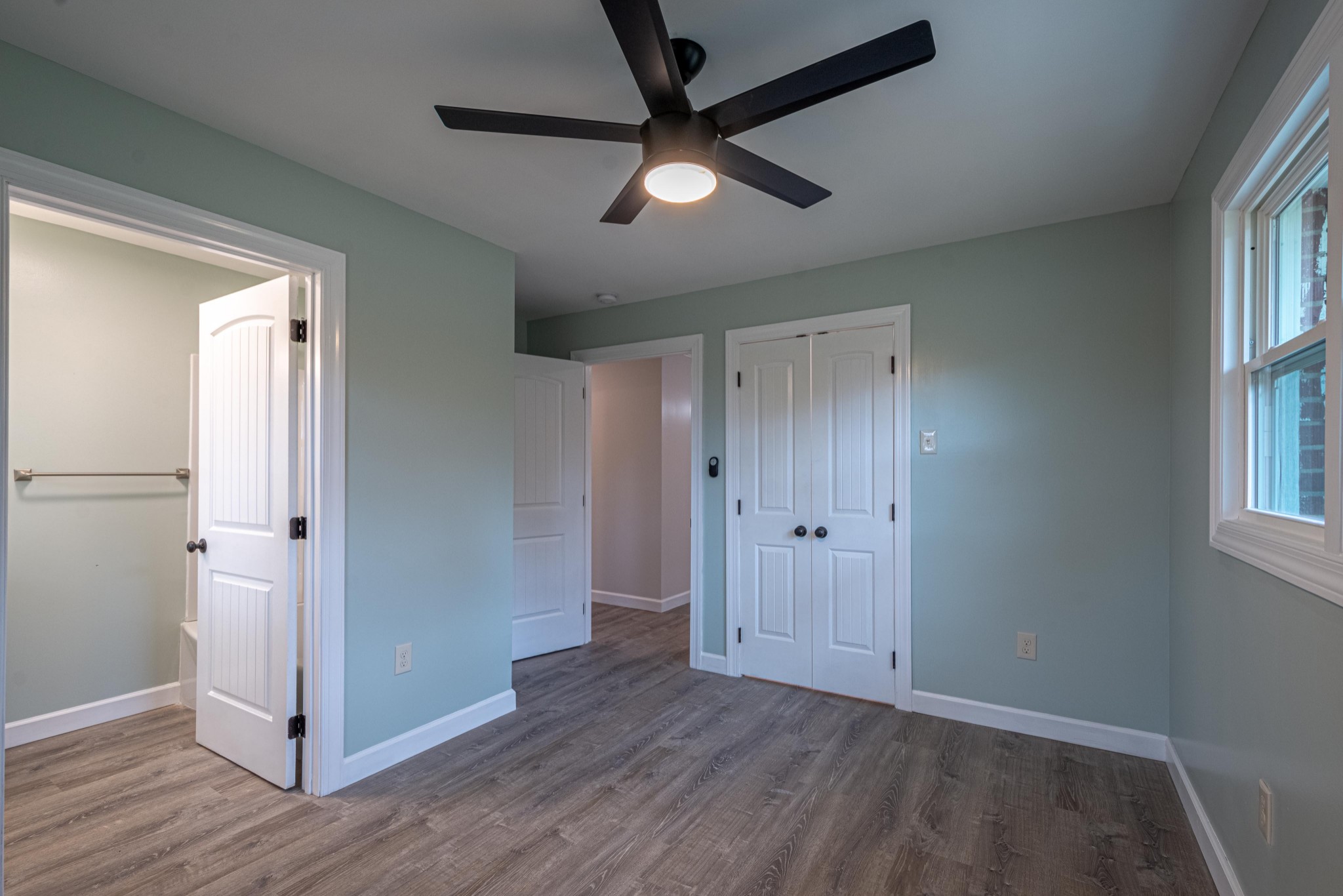 1844 Prospect Elkton Road Prospect, TN 38477 - Photo 21 of 43 a view of empty room with wooden floor and fan