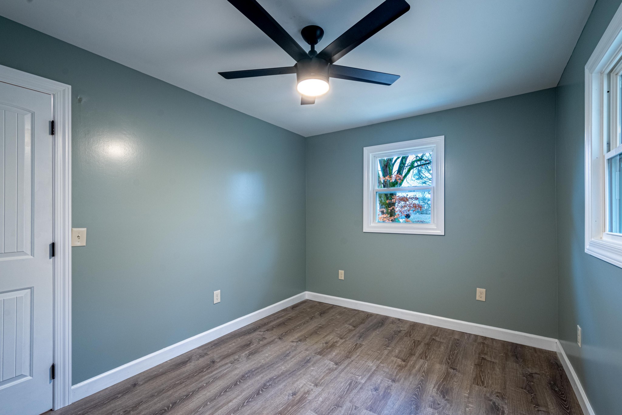 1844 Prospect Elkton Road Prospect, TN 38477 - Photo 26 of 43 an empty room with wooden floor and ceiling fan