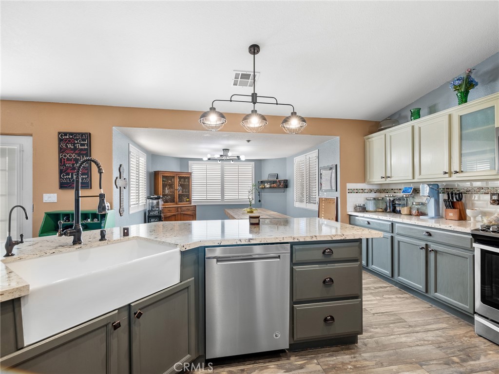 12326 Silver Rock Road Pinon Hills, CA 92372 - Photo 16 of 41 a kitchen with counter top space cabinets and appliances