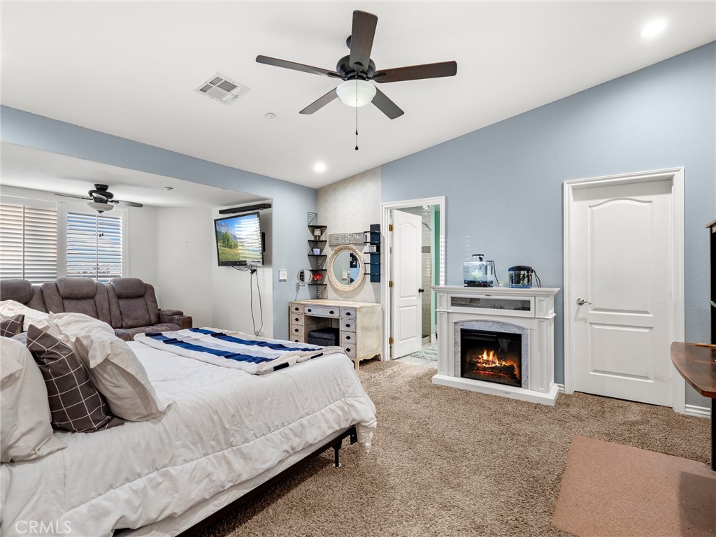 12326 Silver Rock Road Pinon Hills, CA 92372 - Photo 23 of 41 a bedroom with a bed and a fireplace