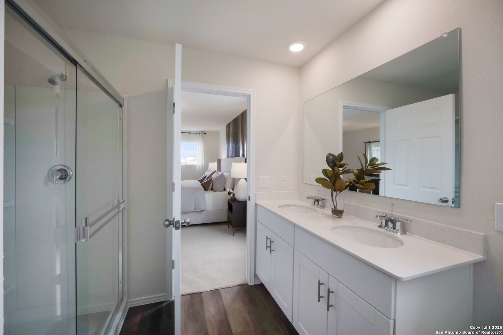 4059 Paddock Trail Seguin, TX 78155 - Photo 20 of 29 a en suite bathroom with a sink double vanity and a mirror