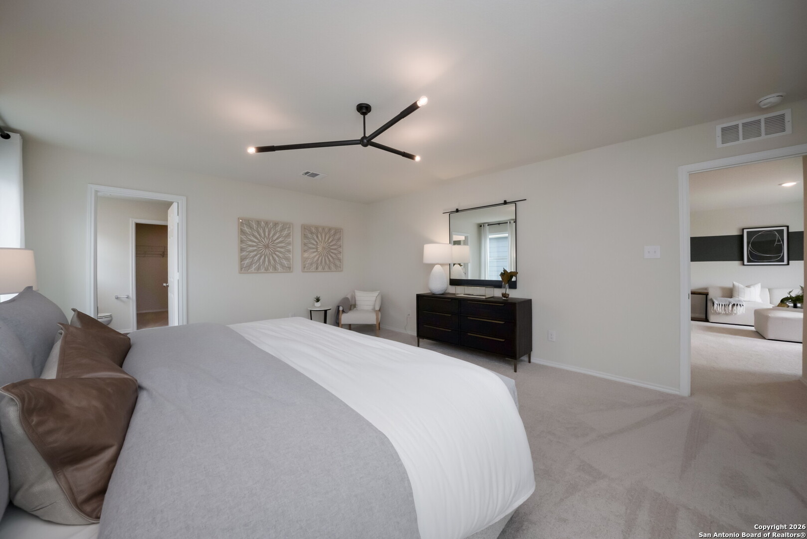 4059 Paddock Trail Seguin, TX 78155 - Photo 21 of 29 a spacious bedroom with a bed and furniture
