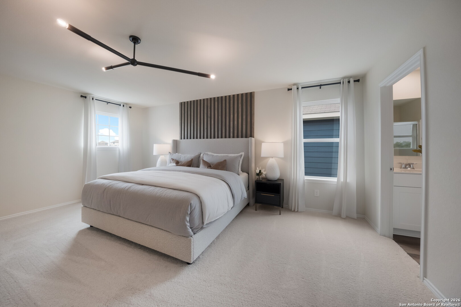 4059 Paddock Trail Seguin, TX 78155 - Photo 22 of 29 a spacious bedroom with a bed and a window