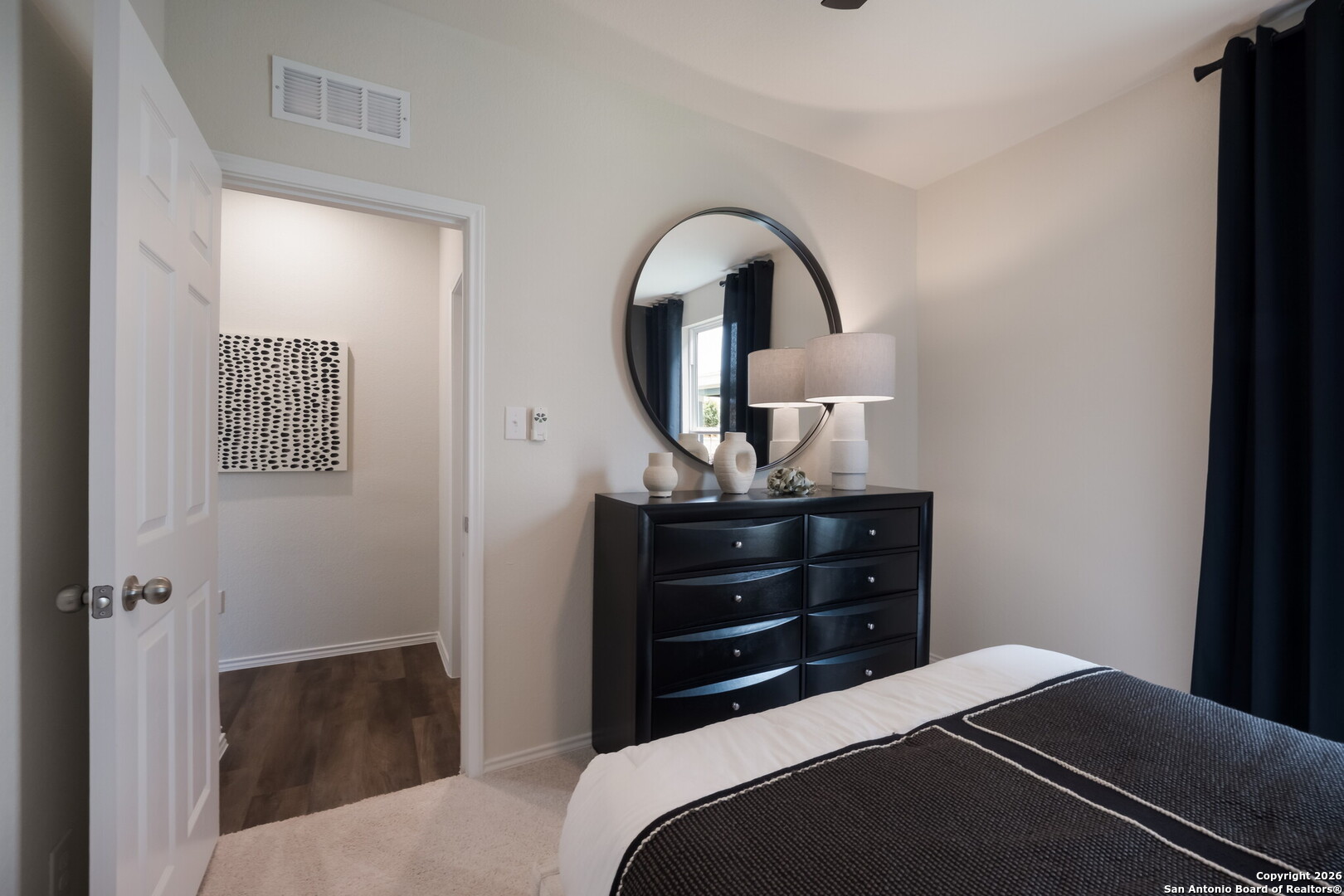 4059 Paddock Trail Seguin, TX 78155 - Photo 25 of 29 a bedroom with a bed and a dresser