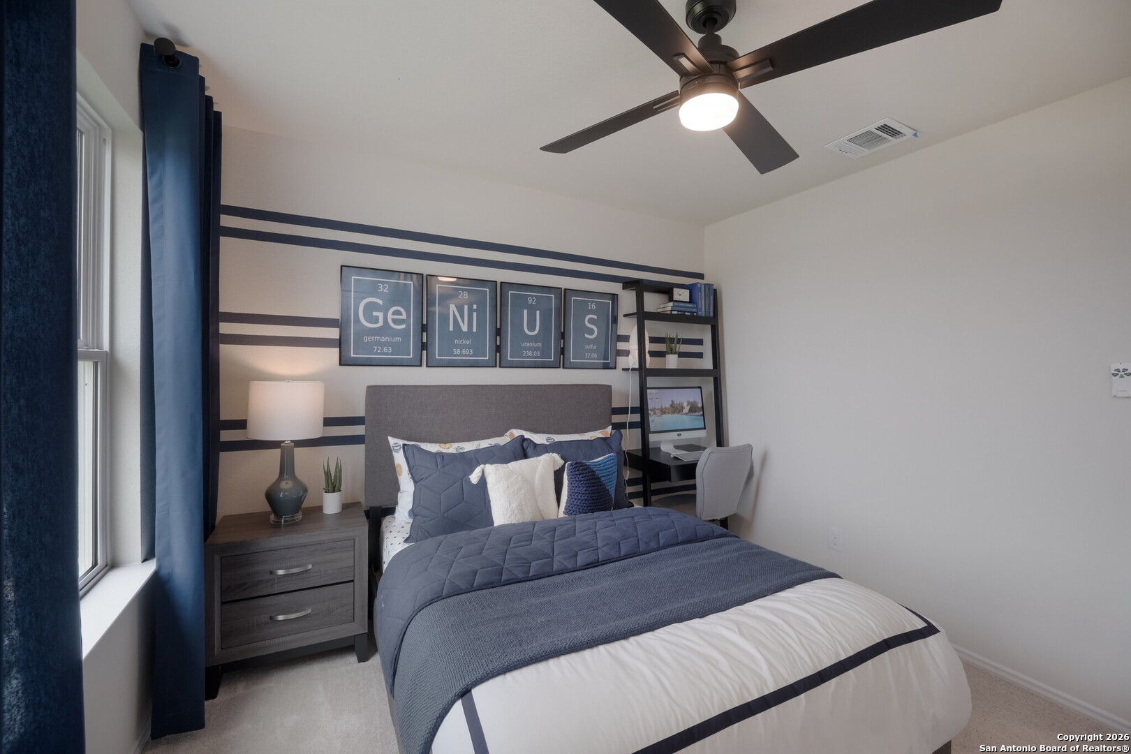 4059 Paddock Trail Seguin, TX 78155 - Photo 9 of 29 a bedroom with a bed and a chandelier