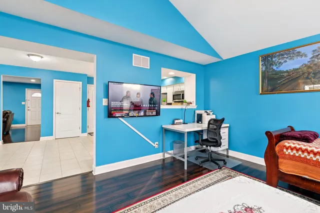 a workspace with furniture and wooden floor