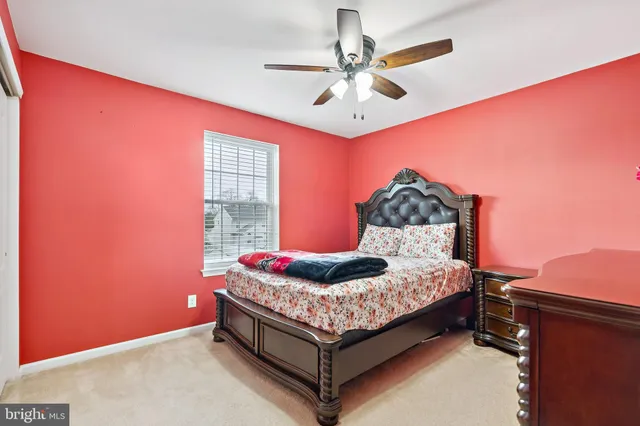 a bed room with a bed and a window