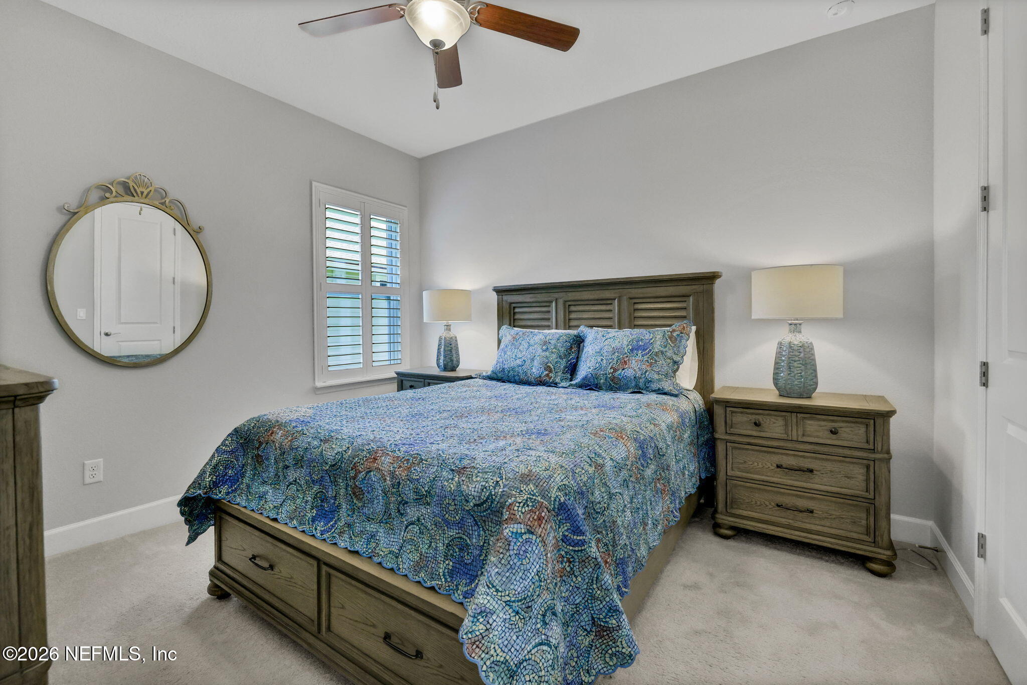 146 Clarendon Road St. Johns, FL 32259 - Photo 31 of 59 a bedroom with a bed and a chandelier