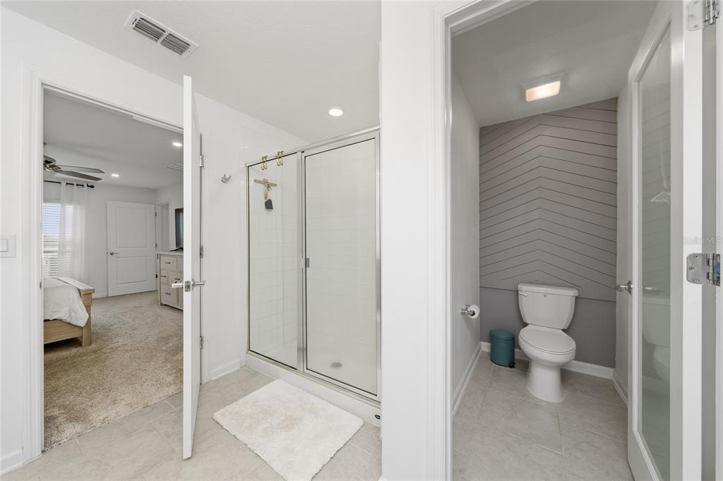 5121 Four Strand Court St. Cloud, FL 34772 - Photo 15 of 26 a bathroom that has a toilet