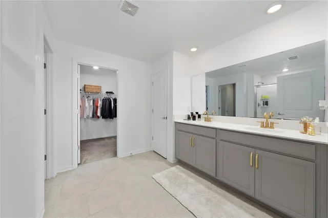 a bathroom with a sink and mirror