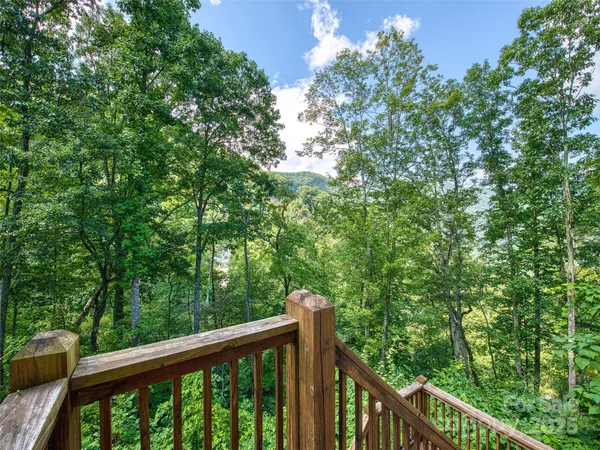a balcony with trees in front of it