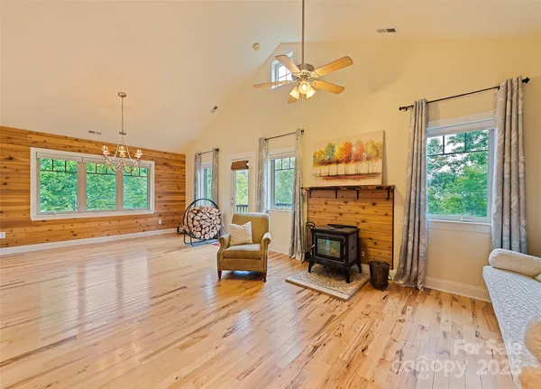 a living room with furniture fireplace and flat screen tv