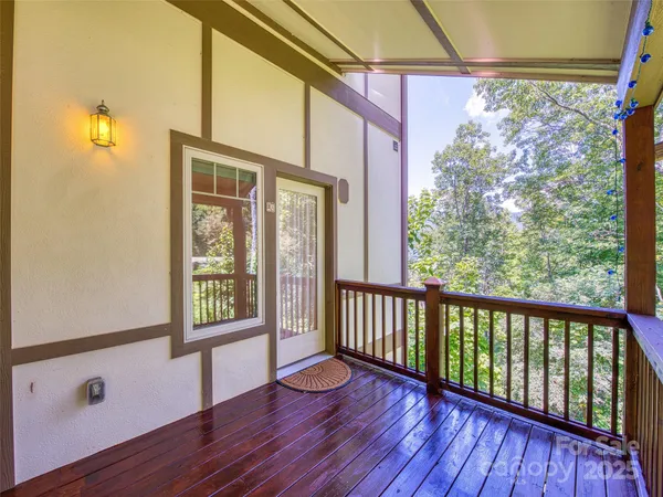 a view of a porch with wooden floor