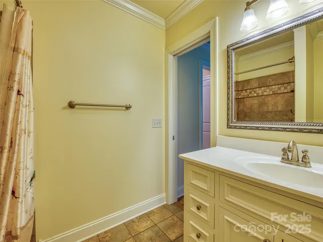a bathroom with a sink and a window