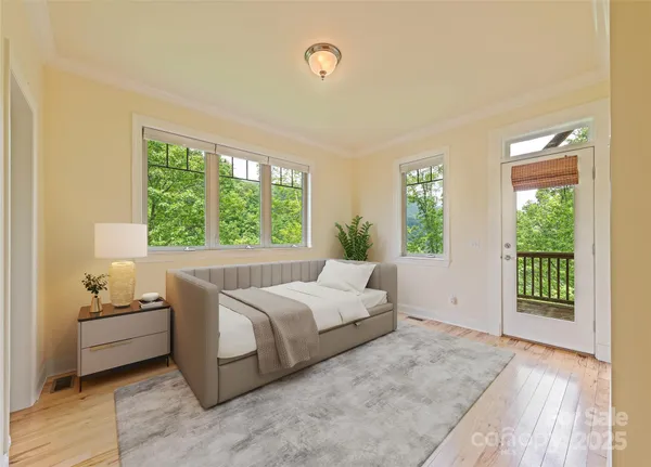 a bedroom with a large bed and a window