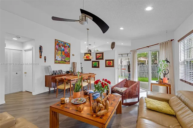 a view of a dining room with furniture and wooden floor