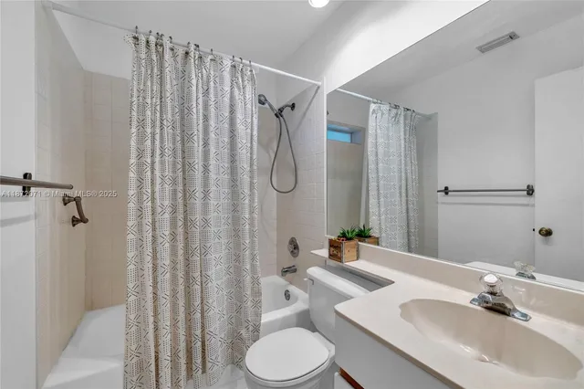 a utility room with sink dryer and washer