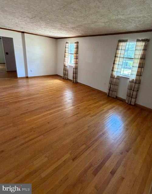 108 Kingbrook Road Linthicum Heights, MD 21090 - Photo 9 of 15 an empty room with wooden floor and windows