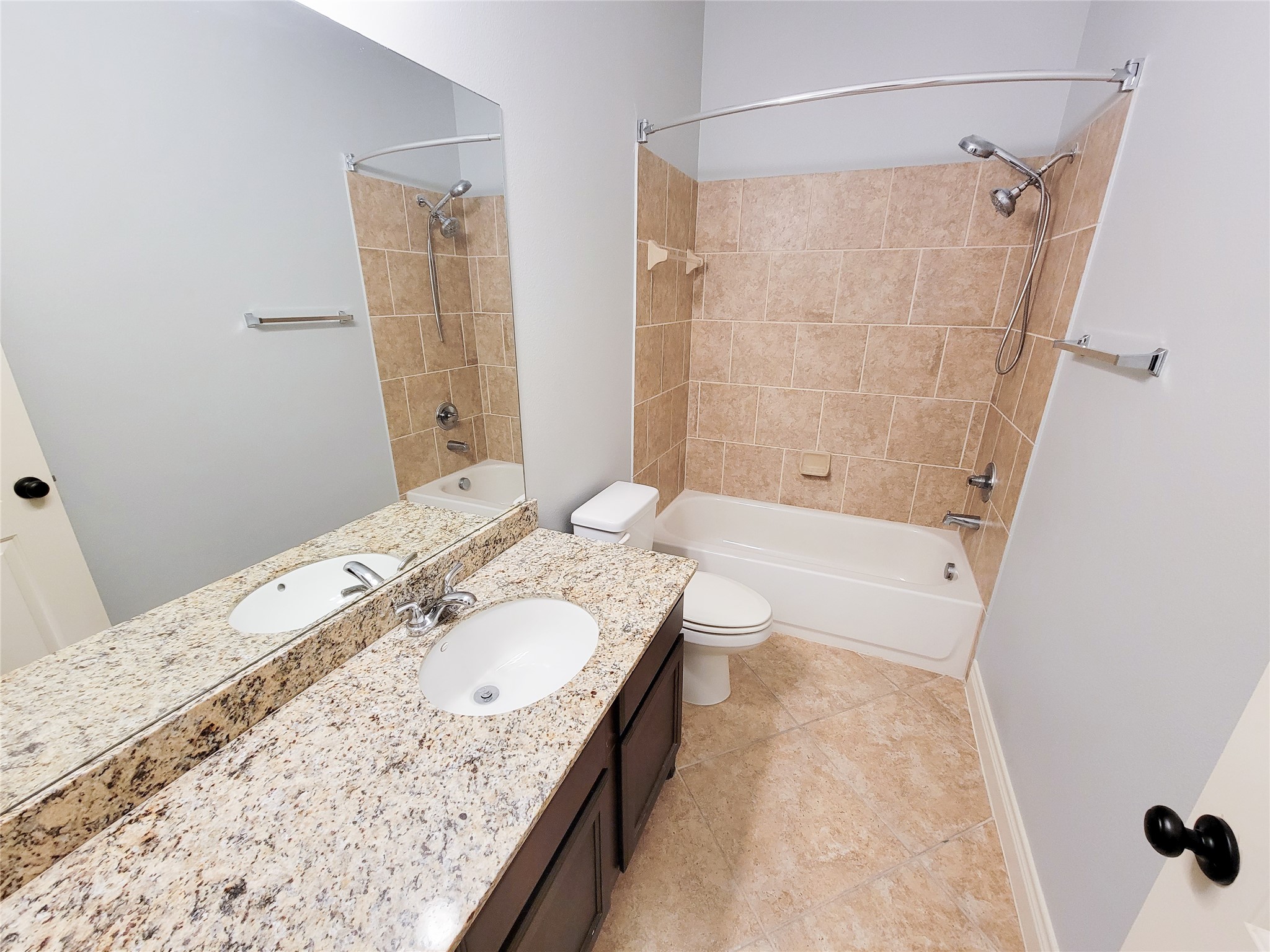 106 Colina Vista Way Montgomery, TX 77316 - Photo 11 of 29 a bathroom with a granite countertop sink a bathtub and shower