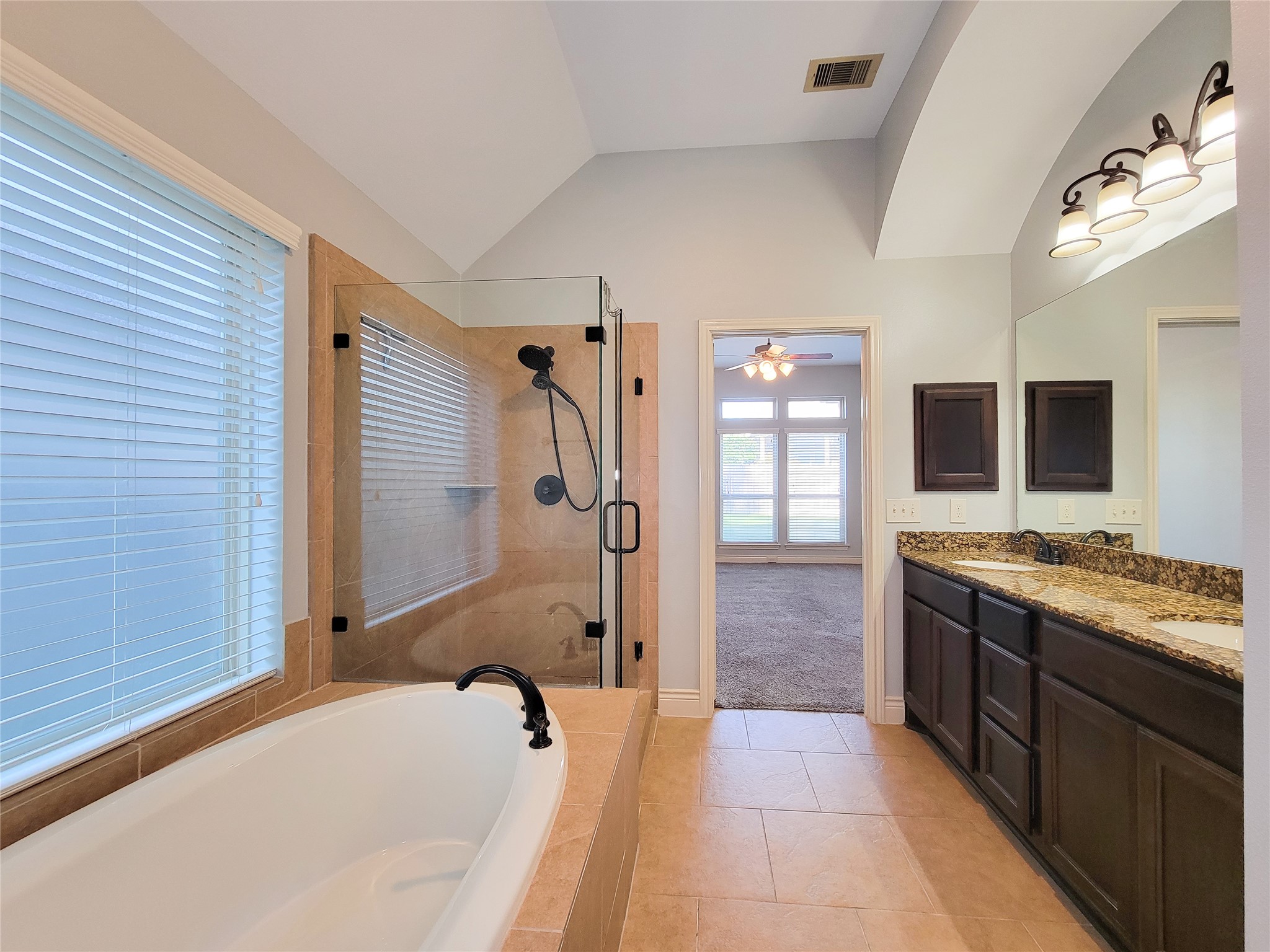 106 Colina Vista Way Montgomery, TX 77316 - Photo 27 of 29 a bathroom with a tub sink and mirror