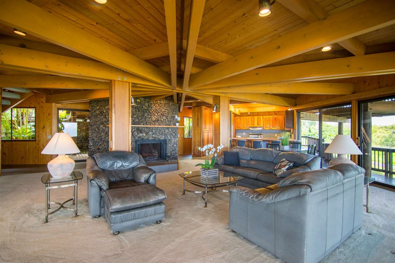 1470 Naalae Road Kula, HI 96790 - Photo 16 of 30 a living room with fireplace furniture and a large window
