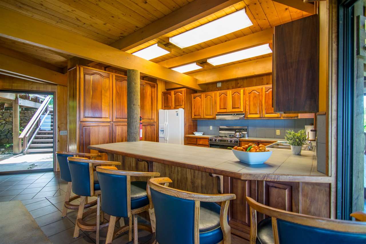 1470 Naalae Road Kula, HI 96790 - Photo 18 of 30 a view of a dining room with furniture window and wooden floor