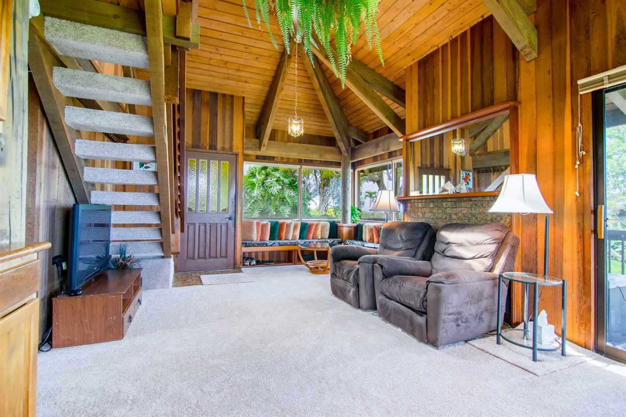 1470 Naalae Road Kula, HI 96790 - Photo 22 of 30 a living room with furniture a ceiling fan and a window