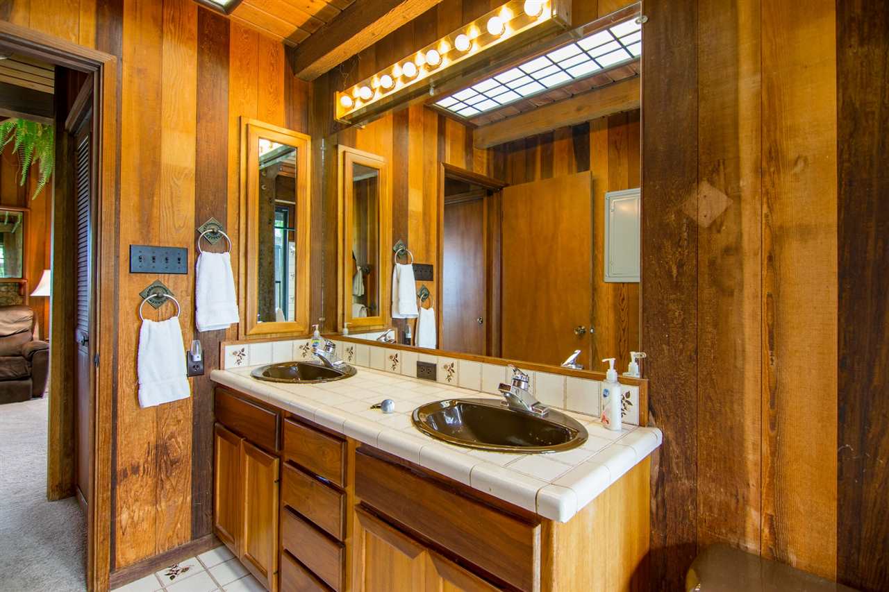 1470 Naalae Road Kula, HI 96790 - Photo 24 of 30 a utility room with a sink and a washer dryer