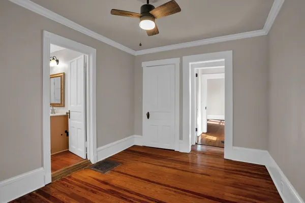 a view of an empty room and wooden floor