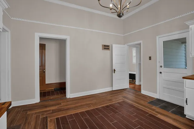 a bedroom with a bed and a view of closet