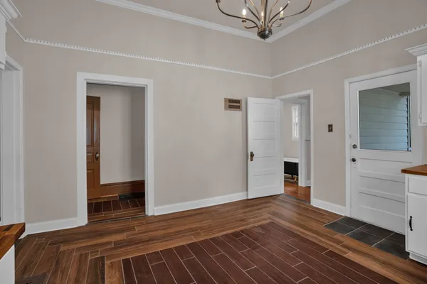 a bedroom with a bed and a view of closet
