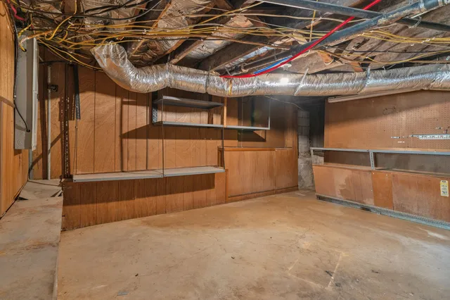 a view of an empty room with a staircase