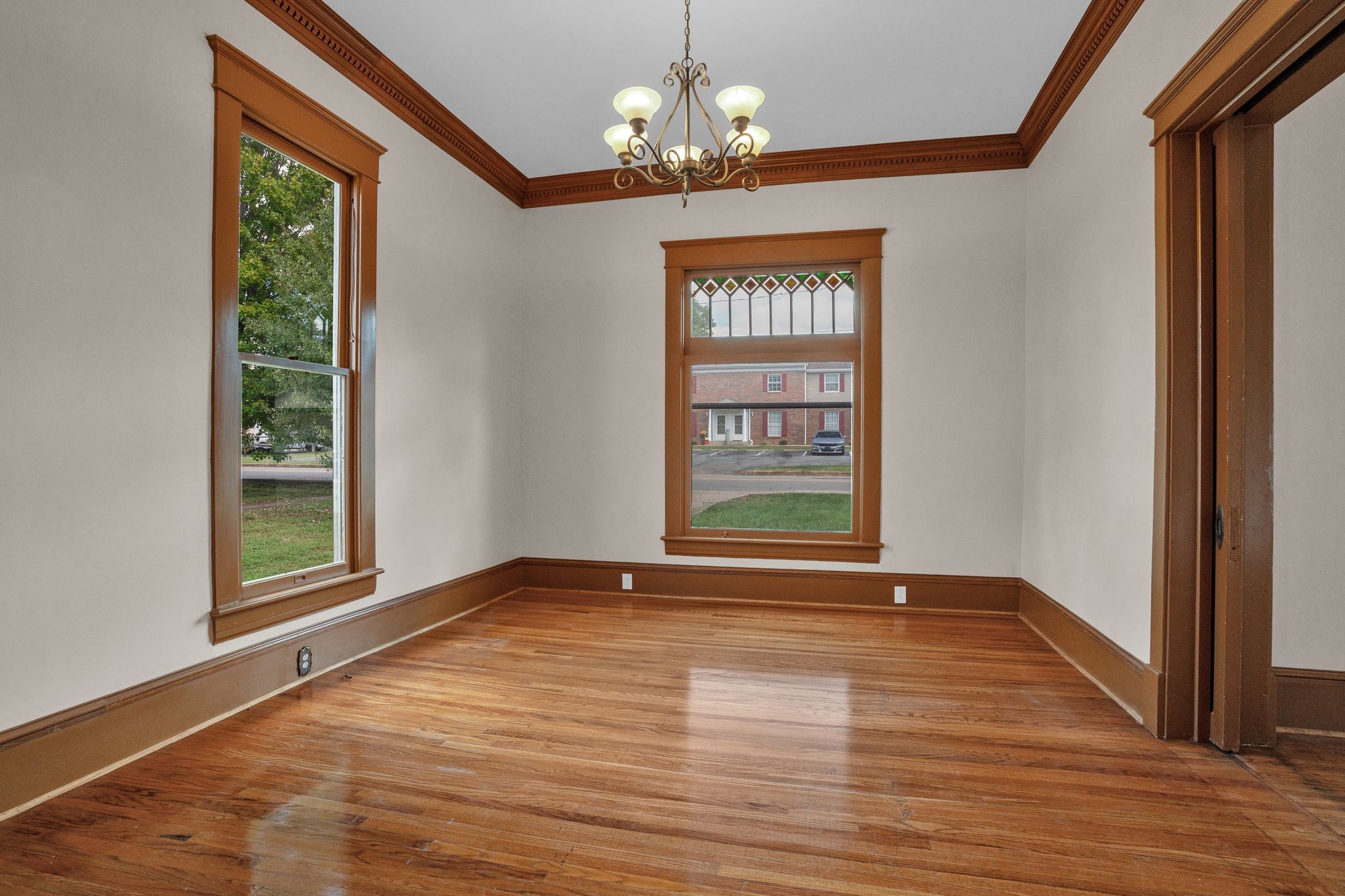 115 North Main Street Springfield, TN 37172 - Photo 7 of 34 a view of an empty room with a window and wooden floor