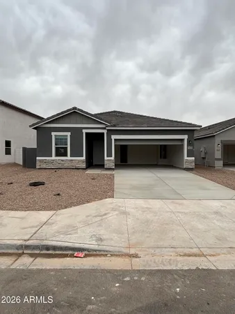 a front view of a house with yard