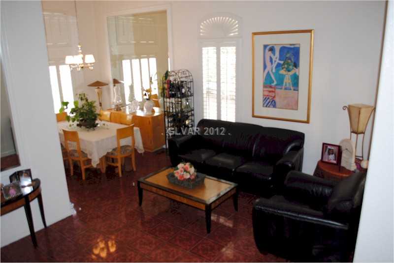 22 Rue De Parc Henderson, NV 89074 - Photo 14 of 32 Living Room. Living room with high ceiling and formal dining room.