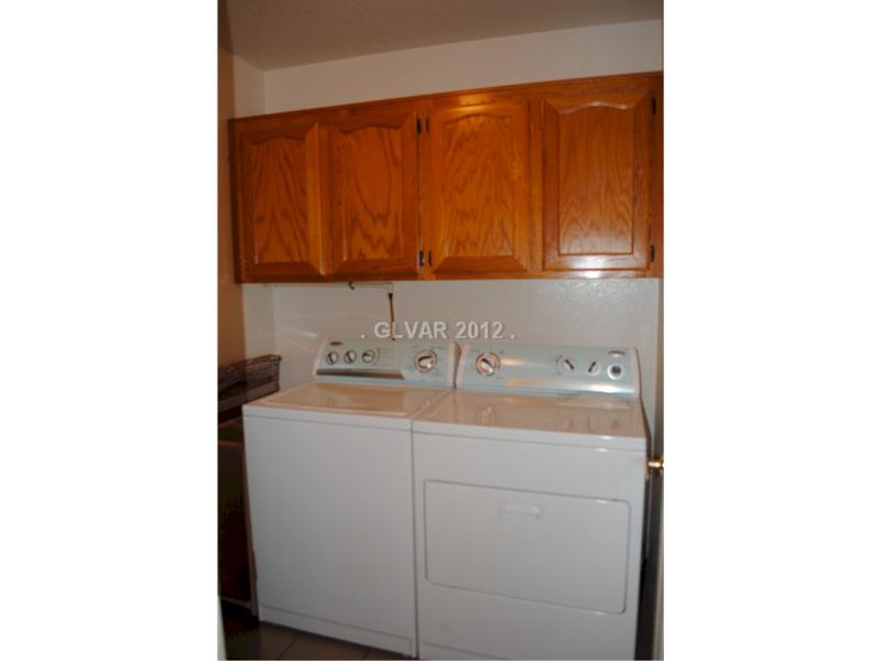 22 Rue De Parc Henderson, NV 89074 - Photo 15 of 32 Other. Laundry room complete with overhead oak cabinets.