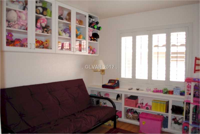22 Rue De Parc Henderson, NV 89074 - Photo 18 of 32 Den. Den/office upstairs, complete with ceiling fan, shutters, and built-in shelves and storage.
