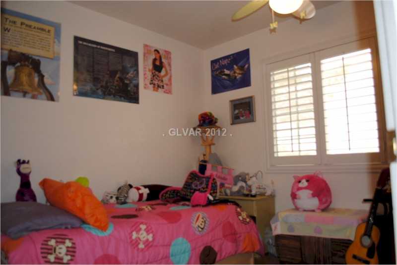 22 Rue De Parc Henderson, NV 89074 - Photo 21 of 32 Bedroom. Bedroom two of three upstairs complete with ceiling fan and shutters.