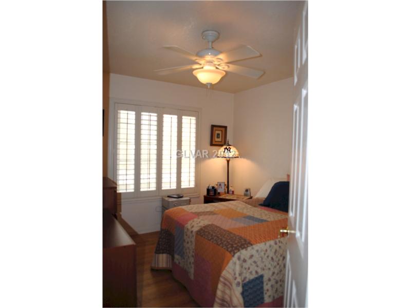 22 Rue De Parc Henderson, NV 89074 - Photo 23 of 32 Bedroom. Bedroom three upstairs complete with ceiling fan and shutters.