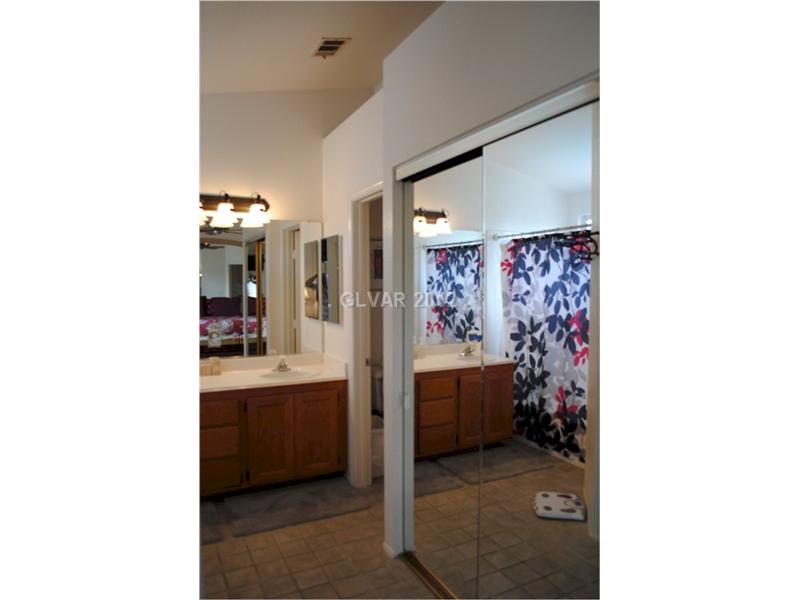 22 Rue De Parc Henderson, NV 89074 - Photo 26 of 32 Master Bath/Spa. Mirrored closet door leading into master bath.