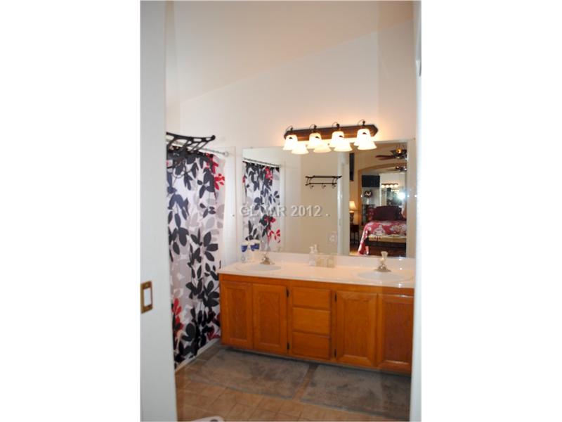 22 Rue De Parc Henderson, NV 89074 - Photo 27 of 32 Master Bath/Spa. Double sink and modern light fixture.