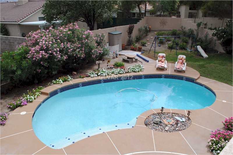 22 Rue De Parc Henderson, NV 89074 - Photo 6 of 32 Swimming Pool/Hot Tub/Sauna. Beautiful Blue Pebble Tech Pool.