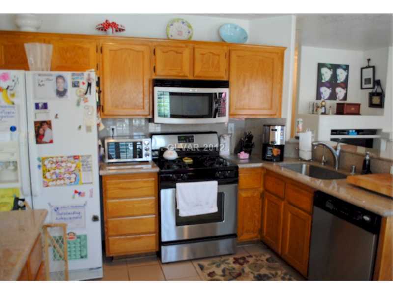 22 Rue De Parc Henderson, NV 89074 - Photo 9 of 32 Kitchen. Kitchen includes stainless steel appliances as shown.